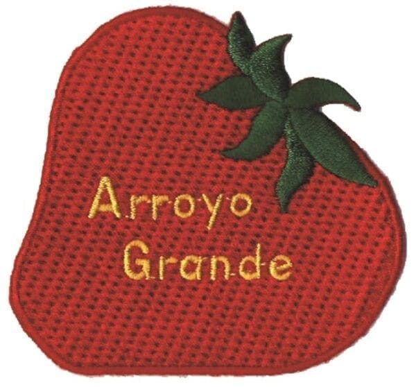 A red strawberry with the word arroyo grande written on it.