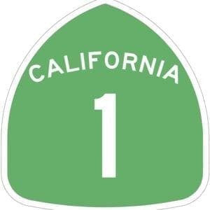 A green highway sign with the number 1 in california.