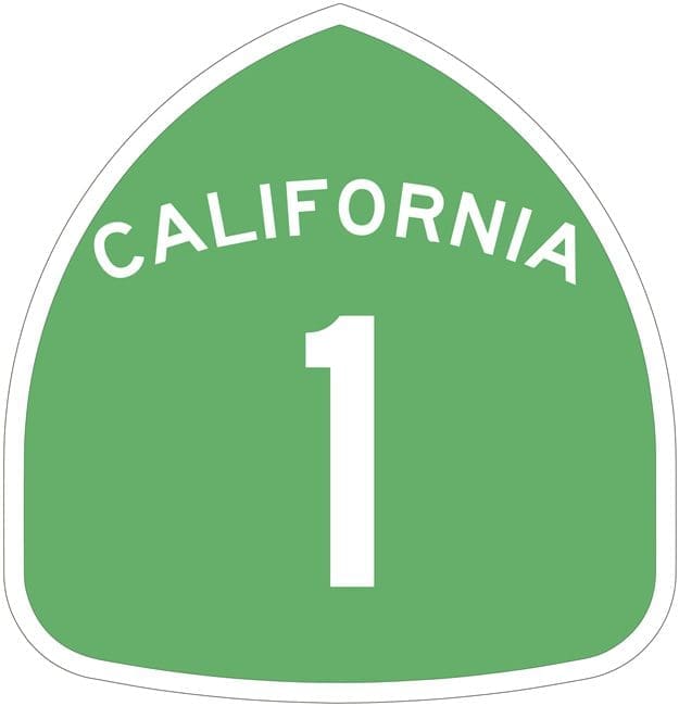 A green highway sign with the number 1 in california.