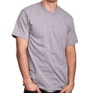 A man wearing a gray t-shirt with his hands in his pockets.