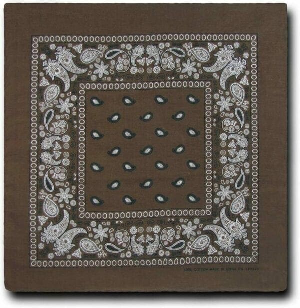 A brown bandana with white paisley design on it.