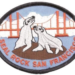 A patch of two polar bears with the golden gate bridge in the background.