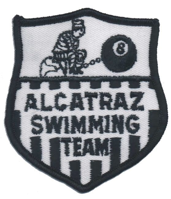 A black and white patch of the alcatraz swimming team.