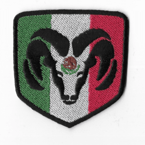 A patch of the mexican flag with an animal head on it.