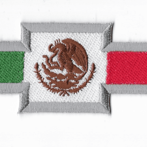 A mexican flag with the emblem of mexico on it.