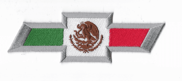 A mexican flag with the emblem of mexico on it.